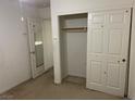 Bedroom with standard closet and interior door. Paint or wallpaper needed at 5334 Floating Flower Ave, Las Vegas, NV 89139
