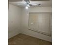 Vacant bedroom featuring a window and a ceiling fan. Ready for new occupants at 5334 Floating Flower Ave, Las Vegas, NV 89139