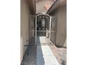 Wrought iron gate with decorative scrollwork at 6092 Fox Creek Ave, Las Vegas, NV 89122