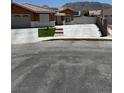 Inviting single-story home with a spacious driveway and well-maintained front yard and mountain view at 6248 Sapporo Cir, Las Vegas, NV 89110