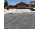 Inviting single-story home with a spacious driveway and well-maintained front yard at 6248 Sapporo Cir, Las Vegas, NV 89110