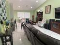 Comfortable living room with marble floors, a vaulted ceiling, and stylish decor at 6248 Sapporo Cir, Las Vegas, NV 89110