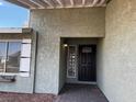 Cozy front porch with a modern door and window, offering curb appeal and charm at 6421 Doby Peak Dr, Las Vegas, NV 89108