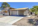 Exterior view of a distressed single-Gathering home with damaged roof and peeling paint at 6723 Oak Valley Dr, Las Vegas, NV 89103