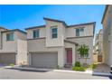 Contemporary two-story home with a two-car garage and desert landscaping at 6940 Crescent Gold St, North Las Vegas, NV 89086