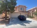 Charming two-story home features a well-manicured front yard and a spacious three-car garage at 9365 Sparkling Waters Ave, Las Vegas, NV 89129