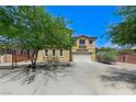 Charming two-story home with a well-maintained front yard and a spacious two-car garage at , North Las Vegas, NV 89084