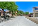 Wide shot view of a home's driveway and desert landscaping surrounding a two-story house at , North Las Vegas, NV 89084