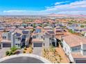 An aerial view of modern homes featuring solar panels, surrounded by desert landscaping at 1038 Delbrook Ave, Henderson, NV 89012