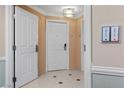Hallway showing unit number and a glimpse of tiled flooring and neutral wall tones at 135 E Harmon Ave # 3816, Las Vegas, NV 89109