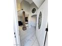 Welcoming home entryway featuring marble flooring and a view into the living room at 1505 Lilac Breeze Cir, Las Vegas, NV 89108