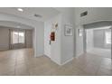 Bright entryway with tiled floor and staircase to upper level at 2586 Begonia Valley Ave, Henderson, NV 89074