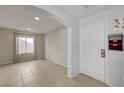 Clean entryway with tile floors, neutral walls and natural light at 2586 Begonia Valley Ave, Henderson, NV 89074