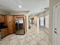Bright kitchen with stainless steel appliances, tile floors, and a door to the outside at 5524 Markley Ave, Las Vegas, NV 89141