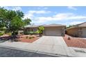 Well-maintained single-Gathering home with a two-car garage, mature trees, and attractive landscaping at 5586 Golden Leaf Ave, Las Vegas, NV 89122