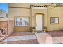 A welcoming front entrance, showcasing a neutral exterior with a well-maintained walkway at 6320 Desert Leaf St # 101, North Las Vegas, NV 89081