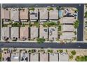 Real estate aerial view of a residential neighborhood with manicured lawns at 6403 Ava Ridge Ave, Las Vegas, NV 89141
