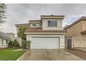 Charming two-story home featuring a well-manicured lawn, new roof and a spacious two-car garage at 7267 W Mesa Vista Ave, Las Vegas, NV 89113