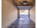 Empty garage with open door at 8717 Tom Noon Ave # 101, Las Vegas, NV 89178