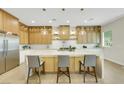 Bright kitchen features a spacious island, pendant lighting, and custom cabinets at 10277 Roma Madre Ave, Las Vegas, NV 89135