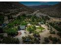 Picturesque property with mature trees and a well-maintained home, offering privacy and scenic mountain views at 18480 State Hwy 160, Las Vegas, NV 89161