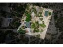 Secluded estate featuring a home with lush greenery, a peaceful atmosphere, and plenty of surrounding land at 18480 State Hwy 160, Las Vegas, NV 89161