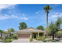 Charming single-story home with a well-manicured lawn and a two-car garage at 1941 Williamsport St, Henderson, NV 89052