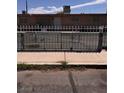 View of the home's gated backyard and building elevation at 2604 Webster St, North Las Vegas, NV 89030