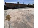 Wide backyard featuring a concrete surface and building elevation at 2604 Webster St, North Las Vegas, NV 89030