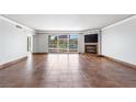Bright living room with tile floors, a fireplace, and large windows offering views of the surrounding landscape at 2857 Paradise Rd # 301, Las Vegas, NV 89109