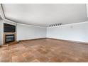 Spacious living room with tile floors and a fireplace, offering plenty of room for furniture and entertaining at 2857 Paradise Rd # 301, Las Vegas, NV 89109