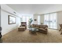 Cozy living room with comfortable furniture and a view from large windows at 2877 Paradise Rd # 906, Las Vegas, NV 89109
