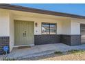 Inviting front entrance with a double door entry and stone accents, creating a welcoming curb appeal at 3047 Van Buskirk Cir, Las Vegas, NV 89121