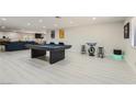This game room has a pool table, bar stools and art at 3047 Van Buskirk Cir, Las Vegas, NV 89121