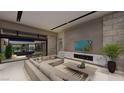 Spacious living room with a fireplace, modern furniture, and seamless indoor-outdoor integration at 7047 Nomi Ct, Las Vegas, NV 89120