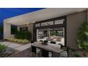 Outdoor dining area with modern table and chairs, offering a view to interior living spaces at 7047 Nomi Ct, Las Vegas, NV 89120