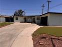 Charming single-story home with a spacious driveway and well-maintained front yard at 3900 San Angelo Ave, Las Vegas, NV 89102