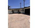 Contemporary single-story home showcasing a spacious driveway and a welcoming entrance at 3900 San Angelo Ave, Las Vegas, NV 89102