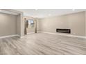 Spacious living room with hardwood floors, modern fireplace, and bright natural light at 4301 San Joaquin Ave, Las Vegas, NV 89102
