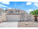 Charming two-story home with a well-kept front yard and attached two-car garage at 4604 Barnes Ct, Las Vegas, NV 89147