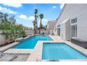 Backyard pool with jacuzzi, deck and palm trees at 4604 Barnes Ct, Las Vegas, NV 89147