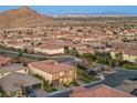 Elevated view of a desert community showcasing houses, landscaping, and mountain backdrop at 4702 Amazing View St, Las Vegas, NV 89129