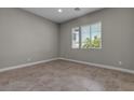 Sunlit bedroom with ceramic tile flooring and double-hung windows at 4829 E Beacon Ridge Dr, Pahrump, NV 89061