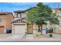 Charming two-story home features a one car garage and a welcoming front entrance at 622 Quaint Acres Ave, Las Vegas, NV 89183