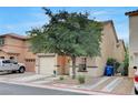 Charming two-story home features a one car garage and low maintenance landscaping at 622 Quaint Acres Ave, Las Vegas, NV 89183