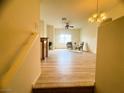 Bright open-concept living area boasting beautiful hardwood floors and neutral paint colors at 6313 Snap Ridge St # 201, North Las Vegas, NV 89081