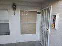 Condo front entrance featuring a security door and outdoor light fixture at 6800 E Lake Mead Blvd # 1126, Las Vegas, NV 89156