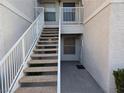 A set of stairs leads to the front door of this condo at 6800 E Lake Mead Blvd # 1126, Las Vegas, NV 89156