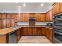 Spacious kitchen with ample cabinet space, granite countertops, and stainless steel appliances at 7252 Royal Melbourne Dr, Las Vegas, NV 89131