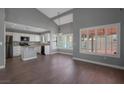 Open floor plan boasting luxury vinyl flooring, high ceilings, and bright natural lighting at 7500 Sea Spray Ave, Las Vegas, NV 89128